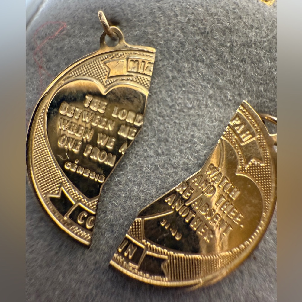 Brand new 14 karat gold
Mizpah two-piece break-apart pendant